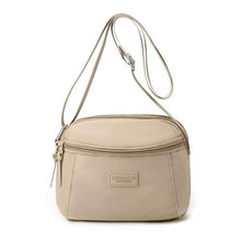Sac à main compact et pratique avec poche zippée, parfait pour vos sorties.