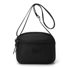 Sac à main compact et pratique avec poche zippée, parfait pour vos sorties.