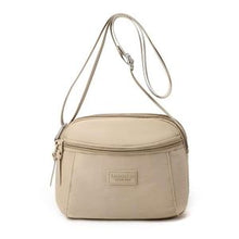 Sac à main compact et pratique avec poche zippée, parfait pour vos sorties.