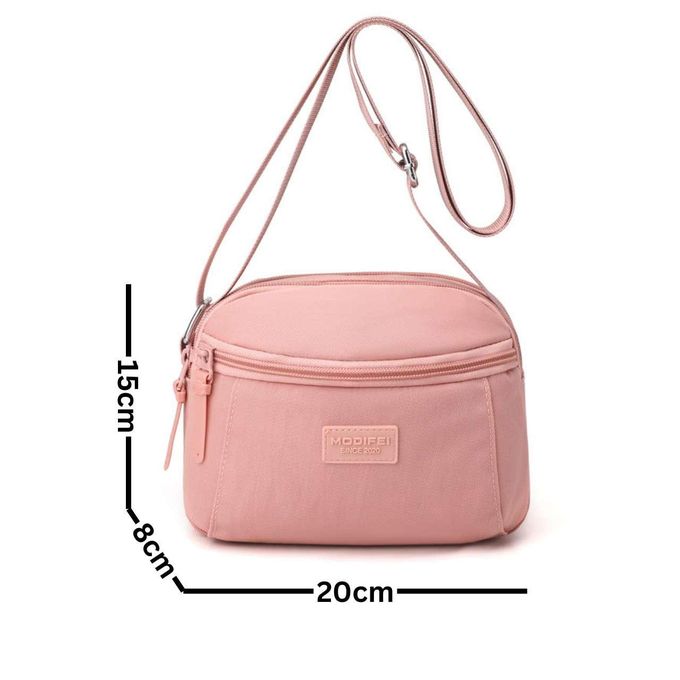 Sac à main compact et pratique avec poche zippée, parfait pour vos sorties.