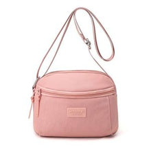 Sac à main compact et pratique avec poche zippée, parfait pour vos sorties.