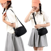 Sac à main compact et pratique avec poche zippée, parfait pour vos sorties.